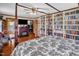 View of Main bedroom with hardwood floors, 4-poster bed, fireplace and custom bookshelves at 771 Cedar Grove Church Rd, Roxboro, NC 27574