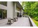 Outdoor living with a backyard deck, chairs, and a grill at 7816 Harbor Dr, Raleigh, NC 27615