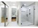 Modern bathroom with a large walk-in shower with a glass door and a view to the bedroom at 7816 Harbor Dr, Raleigh, NC 27615