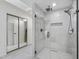 Bathroom showcasing a glass door walk-in shower with black fixtures and a view to the closets at 7816 Harbor Dr, Raleigh, NC 27615