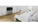 Bedroom featuring hardwood floors, a spacious layout and a TV on top of shelving at 7816 Harbor Dr, Raleigh, NC 27615