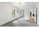 Bright bedroom features plush carpet, natural light, and a mirrored closet at 7816 Harbor Dr, Raleigh, NC 27615