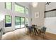 Dining area featuring hardwood floors, stylish furniture, a fireplace, and great natural light at 7816 Harbor Dr, Raleigh, NC 27615