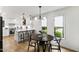 Dining room featuring a modern chandelier and large windows with views of a well-manicured lawn at 7816 Harbor Dr, Raleigh, NC 27615