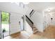 Bright foyer with hardwood floors, white walls, black accents and natural light at 7816 Harbor Dr, Raleigh, NC 27615