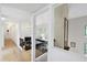 Bright open floor plan with hardwood floors, white trim, high ceilings, exposed brick and large windows at 7816 Harbor Dr, Raleigh, NC 27615