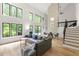 Open living space with high ceilings, clerestory windows, hardwood floors, and comfortable seating at 7816 Harbor Dr, Raleigh, NC 27615