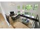 Bright living room with soaring ceilings, large windows, hardwood floors, and stylish chandelier at 7816 Harbor Dr, Raleigh, NC 27615