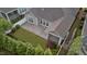 Aerial view of the home highlighting the screened-in porch, patio and fenced yard with manicured lawn at 80 Bramble Ln, Clayton, NC 27527