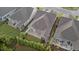 Aerial view of the backyard showcasing the patio, screened-in porch, privacy fence and landscaping at 80 Bramble Ln, Clayton, NC 27527