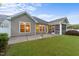 A backyard featuring a screened-in porch and patio area, perfect for outdoor entertaining at 80 Bramble Ln, Clayton, NC 27527