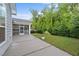 This home boasts a concrete patio, a screened-in porch and fenced-in backyard with lush green landscaping at 80 Bramble Ln, Clayton, NC 27527