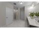 Elegant bathroom featuring dual sinks and a luxurious tiled shower with a glass door at 80 Bramble Ln, Clayton, NC 27527