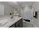 Clean bathroom featuring a shower-tub combo, a modern vanity with marble countertops, and modern fixtures at 80 Bramble Ln, Clayton, NC 27527