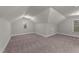Spacious bedroom featuring neutral carpet, two windows offering ample lighting, and a closet at 80 Bramble Ln, Clayton, NC 27527
