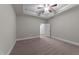 Comfortable bedroom with plush carpeting, ceiling fan, and bright interior at 80 Bramble Ln, Clayton, NC 27527