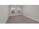 Well-lit bedroom with neutral walls, carpet, and natural light at 80 Bramble Ln, Clayton, NC 27527
