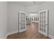 Open dining room showing hardwood floors, and large windows giving a view to the outside at 80 Bramble Ln, Clayton, NC 27527