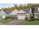 Lovely home showcasing a manicured front lawn and a convenient two-car garage at 80 Bramble Ln, Clayton, NC 27527