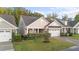 Beautiful one-story home with a well-maintained lawn and a two-car garage at 80 Bramble Ln, Clayton, NC 27527