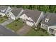 Charming home with a manicured lawn, lovely landscaping, attached two-car garage, and covered front porch at 80 Bramble Ln, Clayton, NC 27527