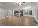 Spacious living area with an open-concept kitchen and large windows for natural light at 80 Bramble Ln, Clayton, NC 27527