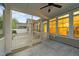 The screened-in porch offers an airy respite with views of the back yard and outdoor entertainment area at 80 Bramble Ln, Clayton, NC 27527