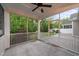 Relax on the screened-in porch with views of the backyard and lush landscaping, perfect for outdoor enjoyment at 80 Bramble Ln, Clayton, NC 27527