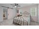 Inviting bedroom featuring a metal bed frame, and ample natural light at 8505 Stonegate Dr, Raleigh, NC 27615
