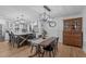 An open-concept kitchen and dining area with modern lighting and ample seating at 8505 Stonegate Dr, Raleigh, NC 27615