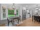 Bright kitchen with breakfast nook, stainless steel appliances, and backyard view at 8505 Stonegate Dr, Raleigh, NC 27615