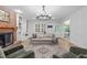Spacious living room featuring a fireplace, built-in shelving, and natural light at 8505 Stonegate Dr, Raleigh, NC 27615