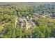 Aerial shot of the neighborhood showcasing lush trees and well-maintained properties at 8816 Valley Springs Pl, Raleigh, NC 27615