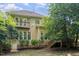 The backyard features a private balcony on the second floor and a covered porch with steps to the yard at 8816 Valley Springs Pl, Raleigh, NC 27615