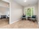 Relaxing bedroom with natural light showcases seating area for reading at 8816 Valley Springs Pl, Raleigh, NC 27615