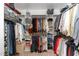 Walk-in closet with shelves and rods provides ample storage for clothes and accessories at 8816 Valley Springs Pl, Raleigh, NC 27615