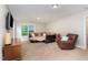 Well-lit living room with a comfortable couch and a television for relaxing at 8816 Valley Springs Pl, Raleigh, NC 27615