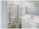 Bathroom featuring a shower, toilet, vanity, and mirror at 8891 Commons Townes Dr, Raleigh, NC 27616