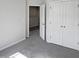 Bedroom with carpeting, double closets, and an open doorway at 8891 Commons Townes Dr, Raleigh, NC 27616