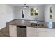 Well-equipped kitchen with an island, granite countertops, and stainless steel appliances at 8891 Commons Townes Dr, Raleigh, NC 27616