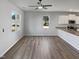 Spacious living area featuring sleek floors and abundant natural light from large windows at 8891 Commons Townes Dr, Raleigh, NC 27616