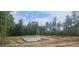 Foundation under construction showing concrete slab and rebar on a wooded lot at 90 Caspian Ct, Lillington, NC 27546