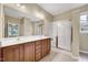 Bright bathroom features double vanity, large mirror and glass enclosed shower at 921 Shefford Town Dr, Rolesville, NC 27571