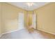 Bedroom featuring carpet flooring, neutral paint, and two doorways at 921 Shefford Town Dr, Rolesville, NC 27571
