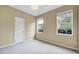 Bedroom featuring carpet, ceiling fan and two windows at 921 Shefford Town Dr, Rolesville, NC 27571