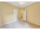 Bright bedroom with neutral carpet, ceiling fan, and white doors for a clean, inviting space at 921 Shefford Town Dr, Rolesville, NC 27571