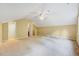 Spacious bonus room featuring carpet flooring, vaulted ceilings, and neutral paint at 921 Shefford Town Dr, Rolesville, NC 27571