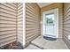Close-up of the front door area displaying the exterior siding at 921 Shefford Town Dr, Rolesville, NC 27571