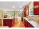 Open floorplan featuring a modern kitchen, island, and seamless transition to the living area and back porch at 921 Shefford Town Dr, Rolesville, NC 27571