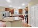 Modern kitchen featuring a large island, stainless steel appliances, and ample cabinet space at 921 Shefford Town Dr, Rolesville, NC 27571